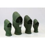 Group of four green stoneware figures of hooded maidens