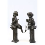 Pair of Bronze Figures of Classical Children sat on Plinths