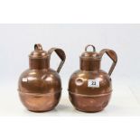 Pair of Guernsey lidded copper jugs