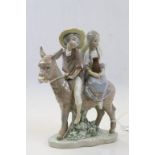 Lladro model of a boy & girl on a donkey