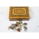Inlaid Sorrento style wooden box with hinged lid containing a small collection of vintage clip on