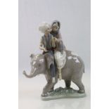 Lladro figure of two children on an elephant