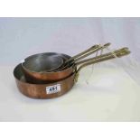 Set of Four Graduating Copper Saucepans with Brass Handles