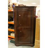 Early 19th century Mahogany Inlaid Corner Cloak Cupboard, the single panel door opening to reveal