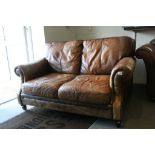 Tan Brown Leather Two Seater Sofa, 146cms long x 87cm high x 106cms deep