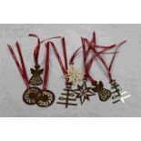 Eight Georg Jensen Gold Tone Christmas Decorations on Red Ribbons