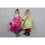 A pair of 20th century oriental hand puppets, male and female