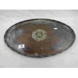 Hugh Wallis Arts and Crafts hammered copper and pewter oval tray, central pewter floral and