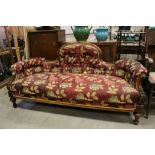 Victorian Walnut Salon Settee with Shaped Back and Curved Ends, scroll carved arms and Button Back