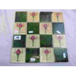 Four Victorian matching Art Nouveau tiles, patchwork design each with two sinuous stylised tulip