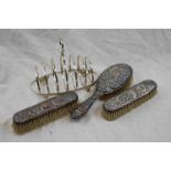 Silver Backed Three Piece Dressing Table Set together with a Mappin & Webb Silver Plated Toast Rack