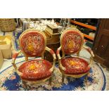 Pair of French Style Gilt Wood Salon Armchairs with Floral Carving and Upholstered in Red and Gold