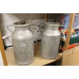 Two Aluminium Milk Churns, one stamped COLIV and the other stamped LNC, approx. 50cms high