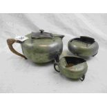 Archibald Knox for Liberty & Co Tudric pewter three piece tea service comprising teapot, sugar