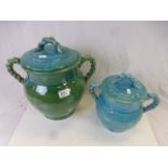 Two Persian Cyan Glazed Lidded Pots with Rope Twisted Handles, 35cms high and 26cms high