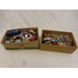 Two boxes of costume jewellery to include necklaces, brooches, compacts, scent bottles, clip on