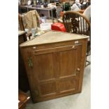 19th century Pine Hanging Corner Cupboard, the single door opening to reveal three shaped shelves,