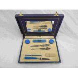 Cased Art Deco Bakelite travel manicure set, repousse silver handles hallmarked Levi & Salaman,