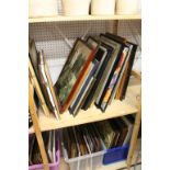 Two Shelves containing a Large Quantity of Pictures and Prints