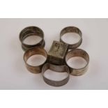 Two similar silver napkin rings, incised banded decoration, makers E J Trevitt & Sons Ltd, Chester