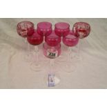 Six Victorian cranberry glass wine glasses, cranberry glass bowls with colourless glass baluster