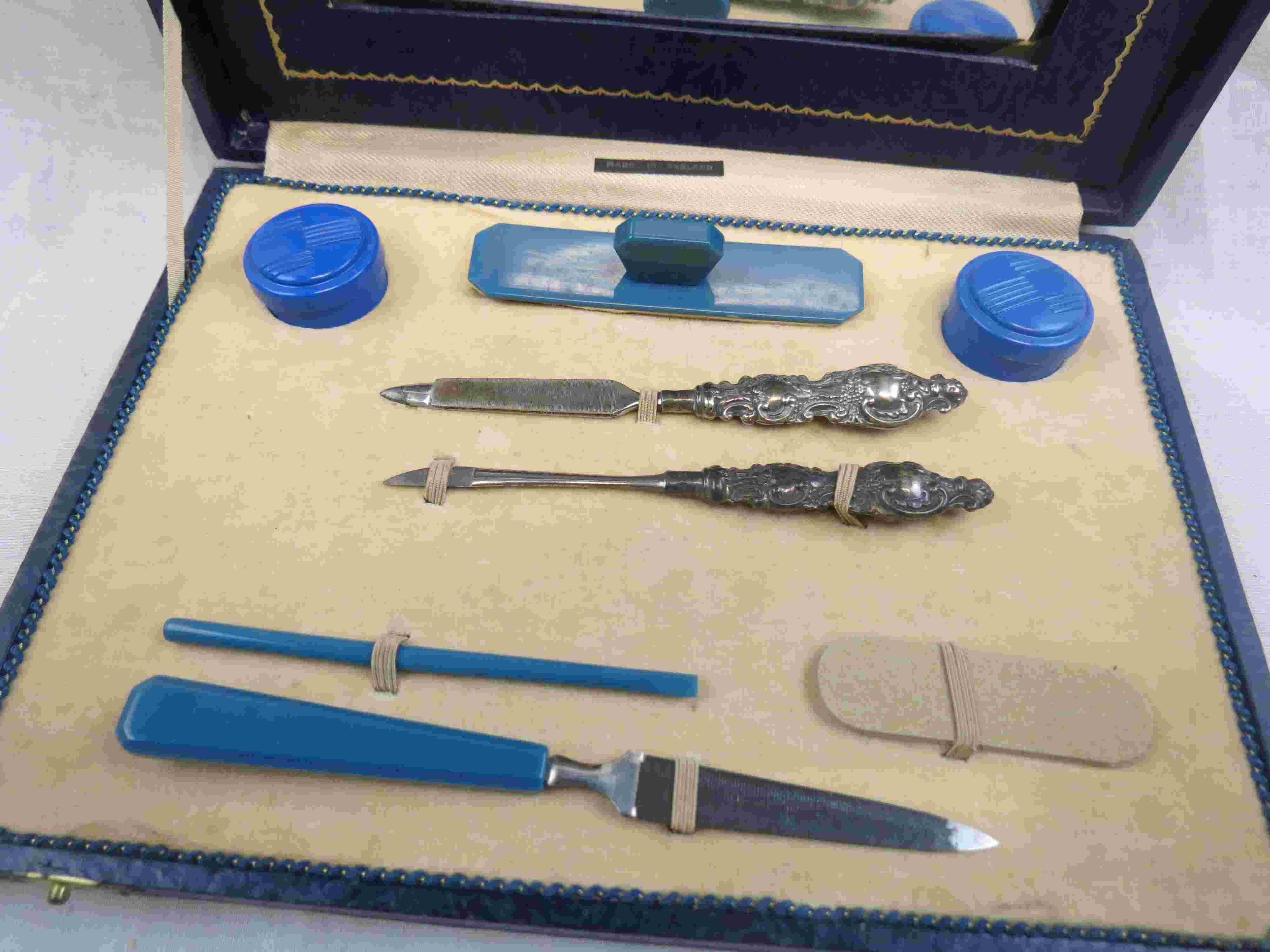 Cased Art Deco Bakelite travel manicure set, repousse silver handles hallmarked Levi & Salaman, - Image 3 of 7