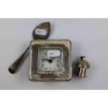Silver fronted travel clock, silver ornament depicting a fairy sat on a toadstool, makers M