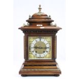 Key wind wooden cased "Ting Tang" Bracket Clock, with ornate metallic dial and gilt Brass detailing,