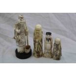 Four bone and resin Japnese figures depicting elders, coloured ink decoration (4)
