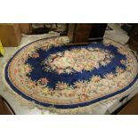 Chinese Oval Blue Ground Rug with Floral Pattern, approx. 280cms x 188cms