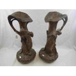 Pair of Art Nouveau plaster of Paris single handled vases, each modelled as a maiden leaning against