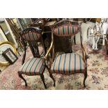 Early 20th century Gentleman Elbow and Ladies Salon Chairs with Carved Back Rail and Splat raised on