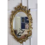 20th century Gilt Framed Ornate Rococo Style Gilt Oval Mirror, 98cms high