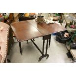 Victorian Mahogany Sutherland Table raised on turned legs with castors