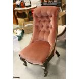 Victorian Nursing Chair with Pink Button Back Upholstery raised on shaped legs