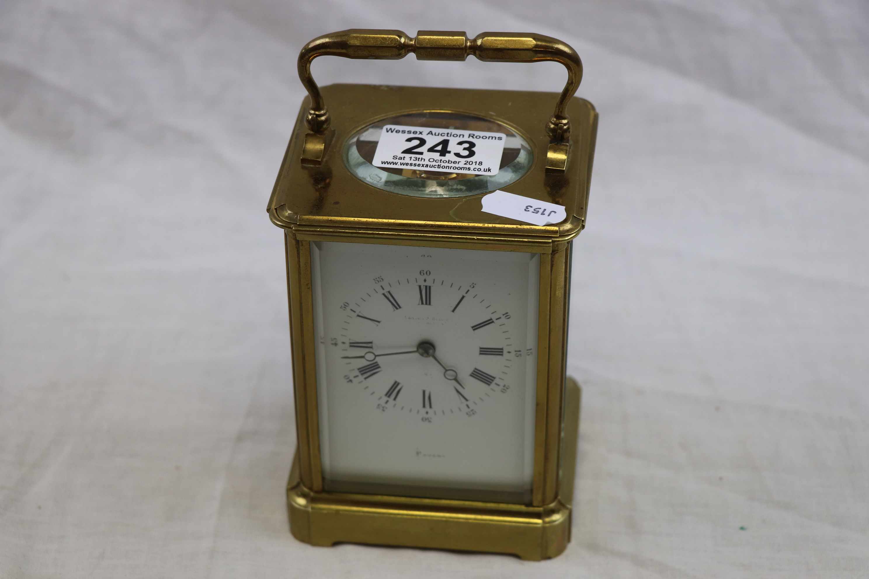 Brass chiming carriage clock, white enamel dial with black Roman numerals with Arabic numerals to