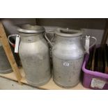 Two Aluminium Milk Churns, one stamped LO 509, approx. 50cms high