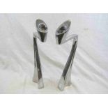 Pair of white metal abstract candlesticks of angular form, height approximately 33cm