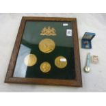 Cased set of commemorative plaster medallions, an onyx and silver pendant necklace, Victorian