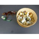 Approximately twenty Wade Whimsies and similar together with three Murano style animal figurines