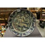 Large Tin Glazed Pottery Charger with Dog and Leaf Sgraffito decoration