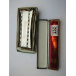 Two Boxed Harmonicas