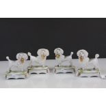 Two pairs of 19th Century ceramic Poodles with Baskets of Flowers & Gilt detailing, one with Chelsea