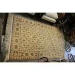 Imperial Jewel Rug, cream ground with muted brown and pink pattern, label description reads CN BN