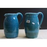 Pair of blue glazed Persian Pitchers, marked "Hand Made Isfahan Iran" to base