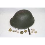 A British Post WW2 1953 Dated MKIV "Turtle" Helmet With A Small Selection Of Military Badges And