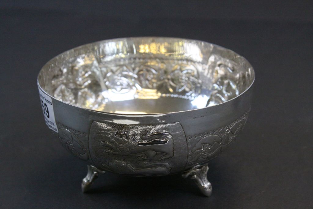 White metal bowl raised on three feet, repousse lion and stylised floral decoration, approximately - Image 3 of 5