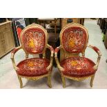 Pair of French Style Gilt Wood Salon Armchairs with Floral Carving and Upholstered in Red and Gold