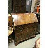 Georgian Mahogany and Veneered Bureau with fitted interior above Four Long Drawers and raised on