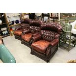 Set of Three Oxblood Red Leather Button Back Armchairs with Brass Studding